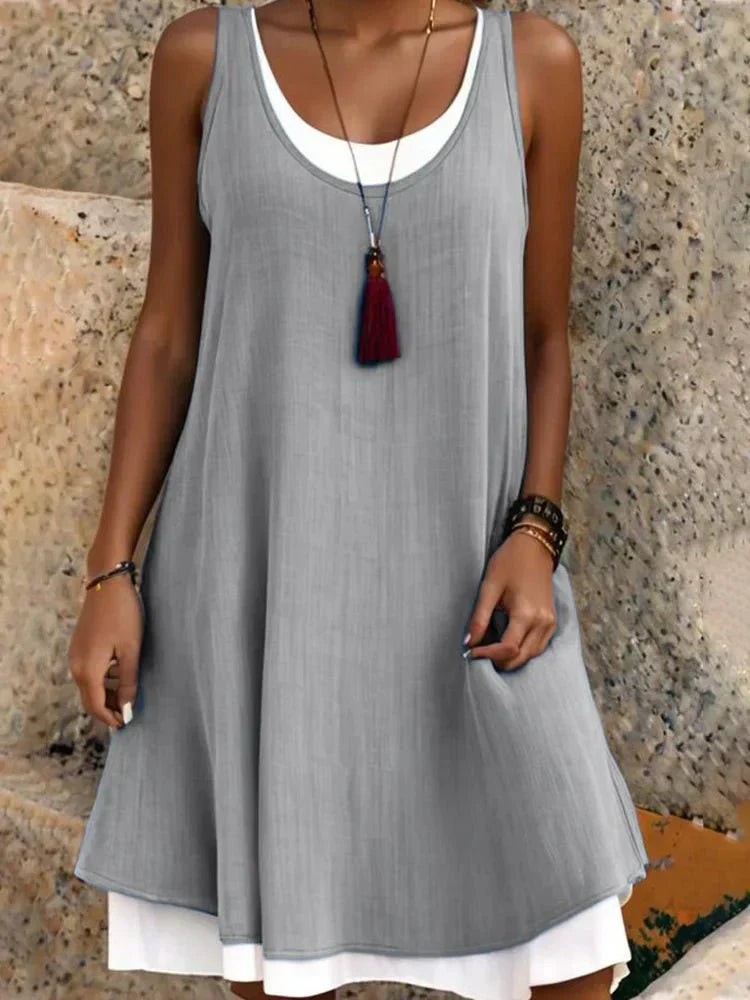 MODEGEIST Damen Lagen-Mini-Kleid Ärmellos Rundhals Zweifarbig Schwarz-Weiß