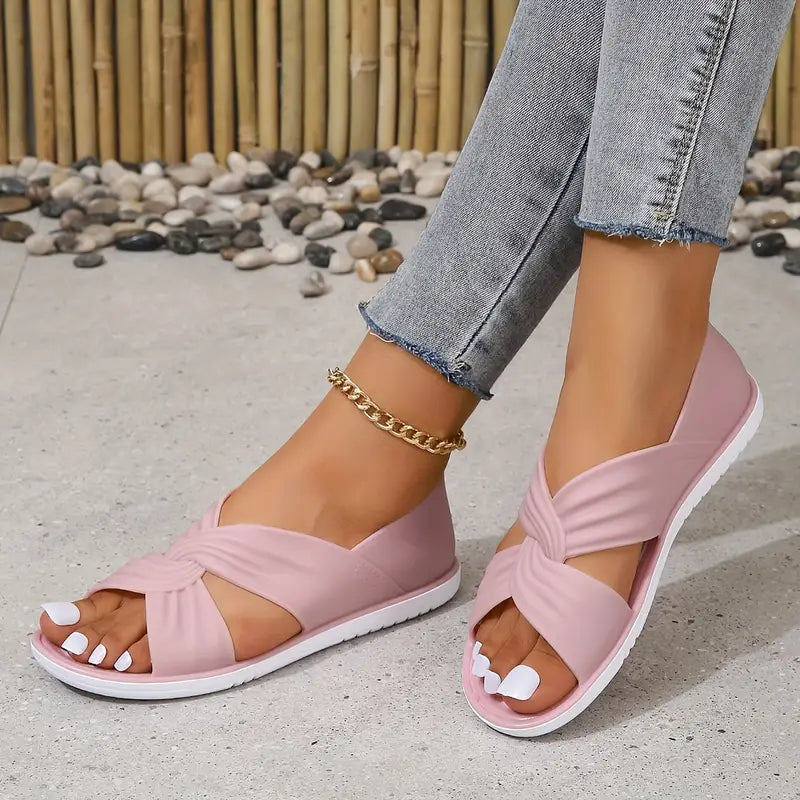 Fleur Schlupf-Sandalen: Leichte, flache Sandalen mit gekreuzten PVC-Riemen