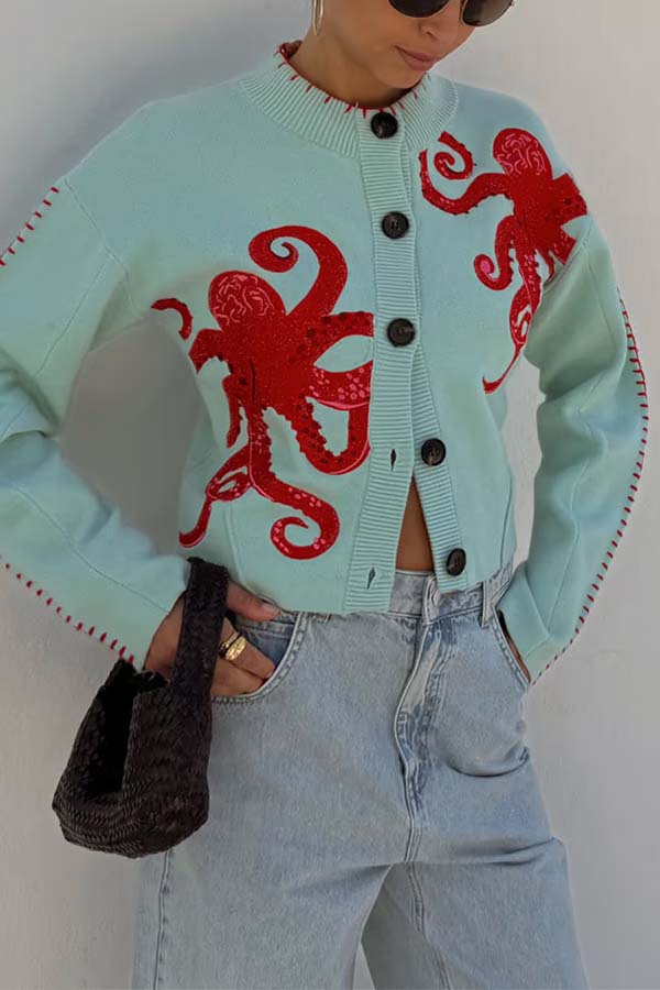 ModeGeist | Küstenstrickjacke mit Oktopus-Motiv und Kontrastpaspelierung