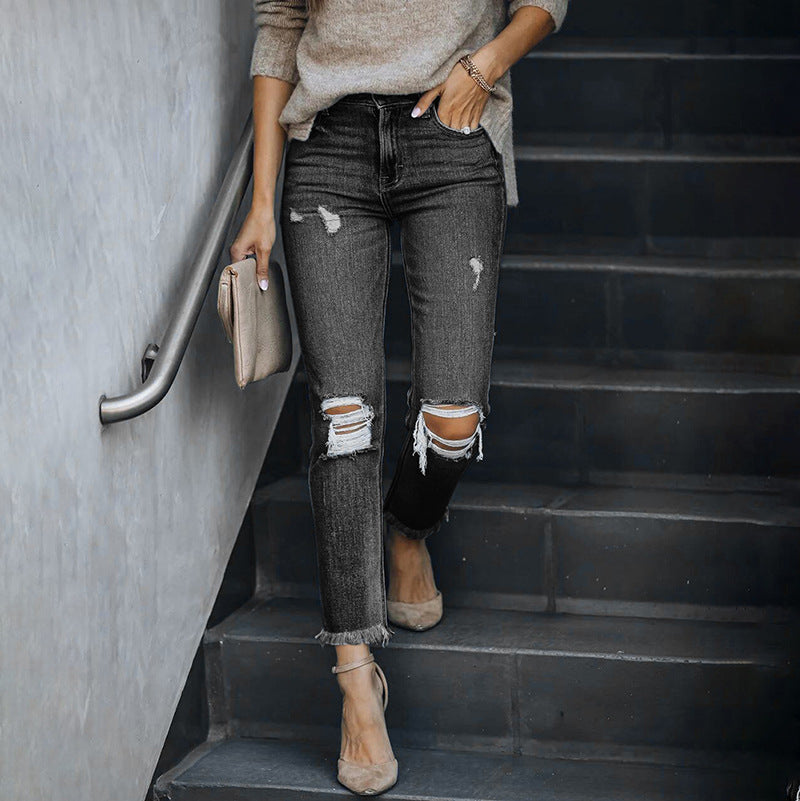 Modische Damen-Skinny-Jeans mit asymmetrischem Saum und Destroyed-Look