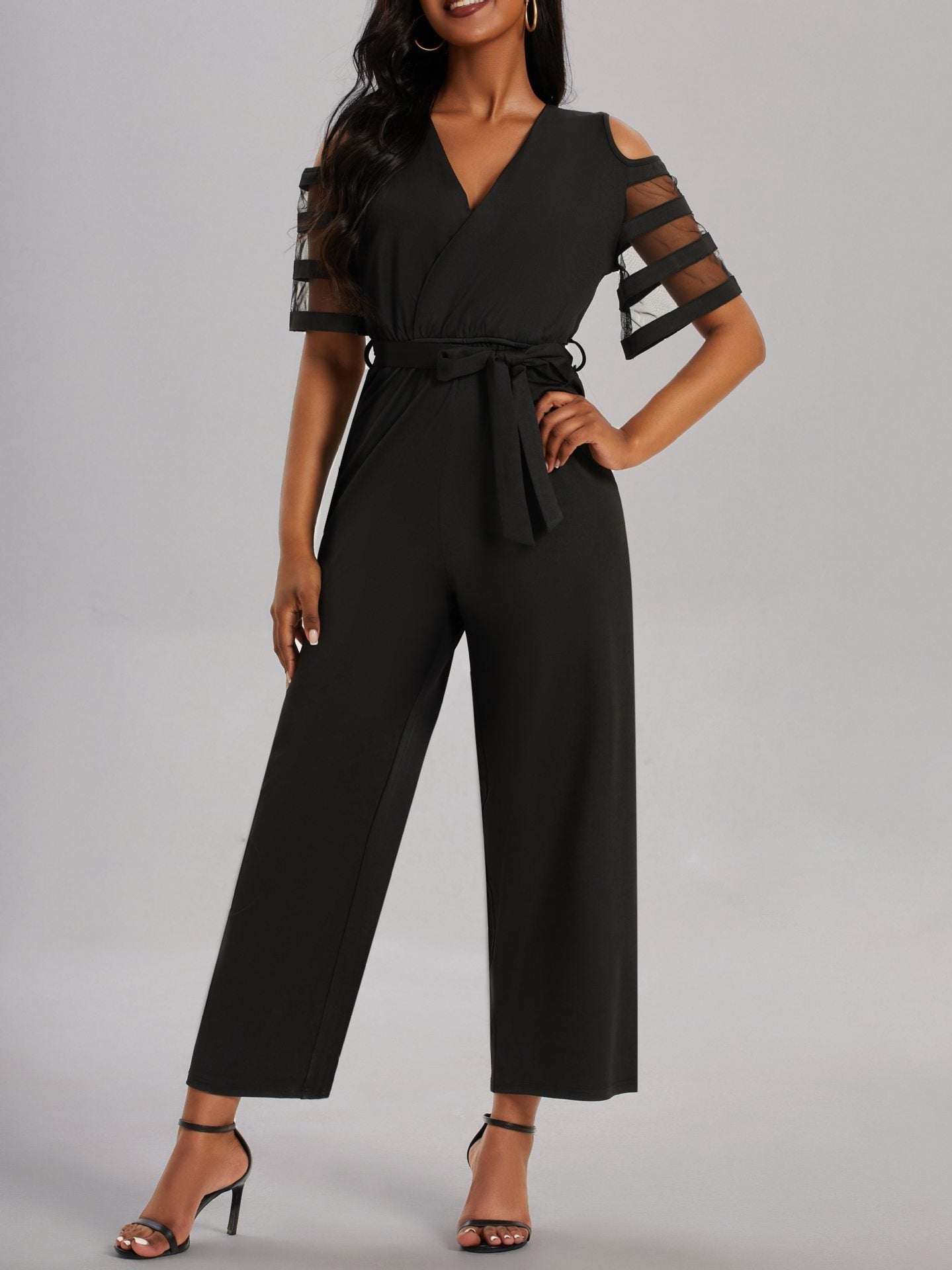 Damen Eleganter Jumpsuit mit transparenten Ärmel-Details und Taillengürtel ModeGeist