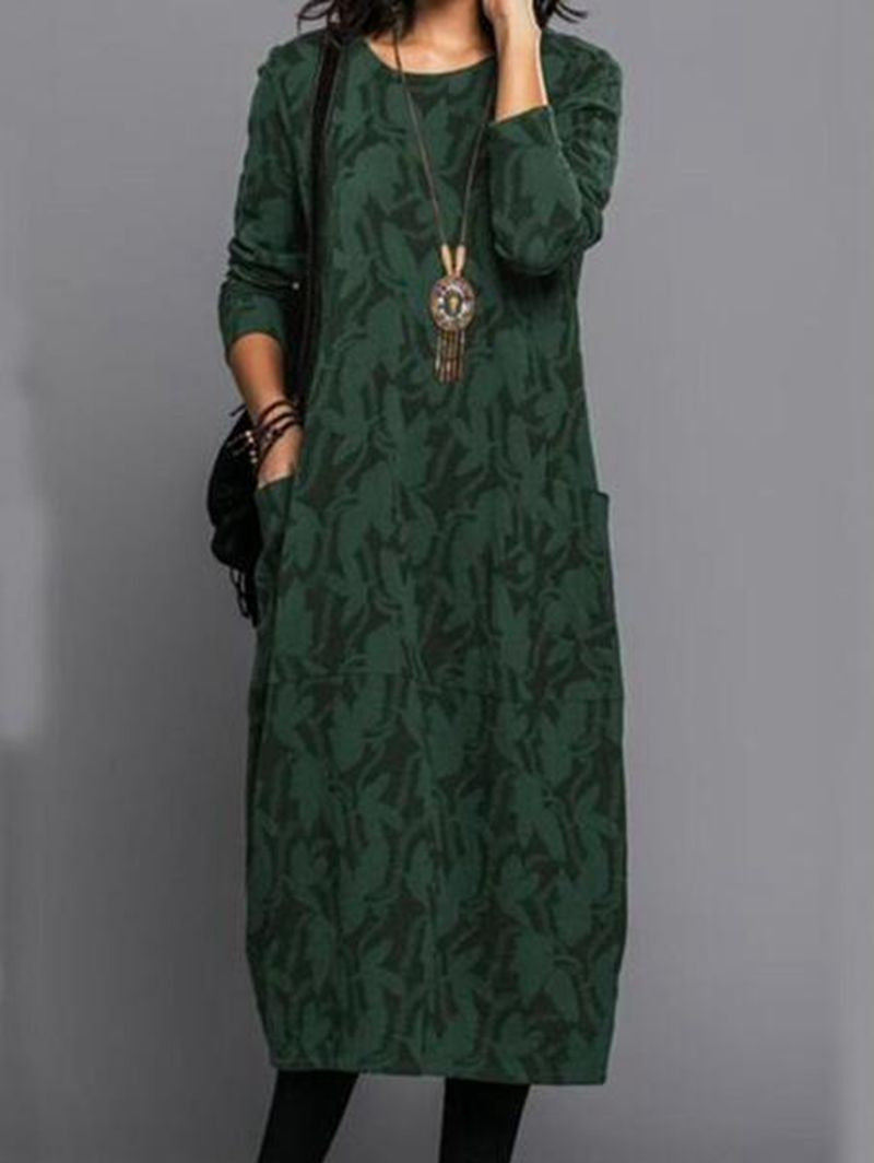 Elegantes Tunika-Kleid mit botanischem Muster, Taschen und lässigem Schnitt von MODEGEIST