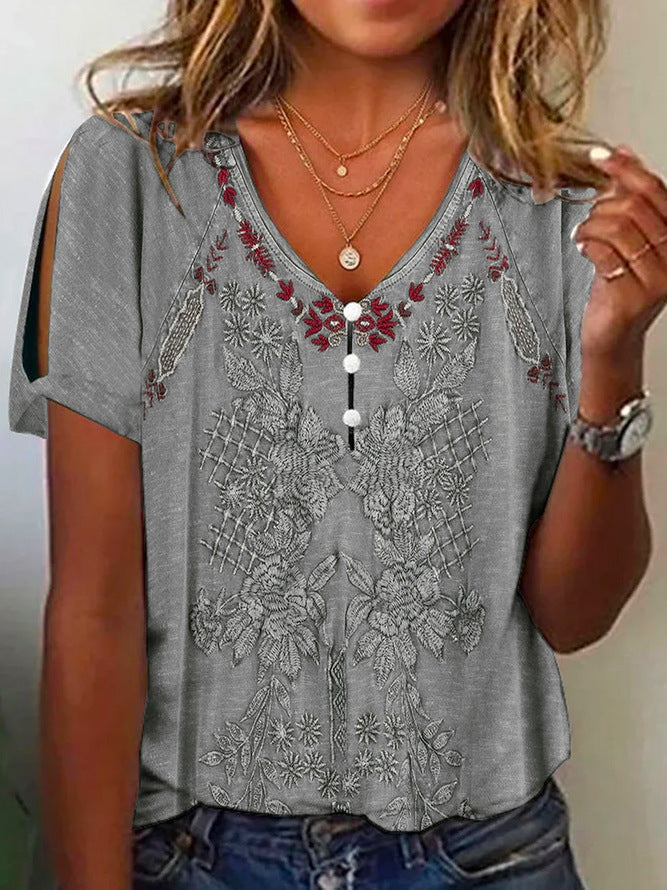 Damen Kurzarmbluse mit floralen Stickereien und Knopfdetails ModeGeist