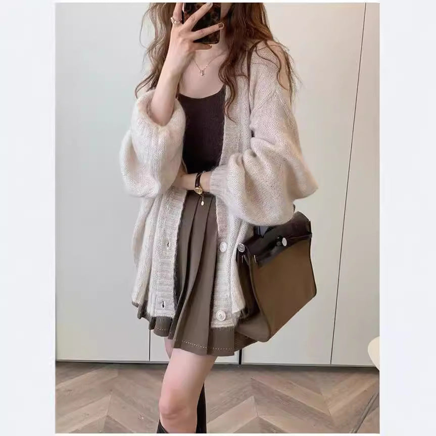Damen Strickjacke im lässigen Oversized-Stil mit voluminösen Ärmeln und praktischen Taschen ModeGeist
