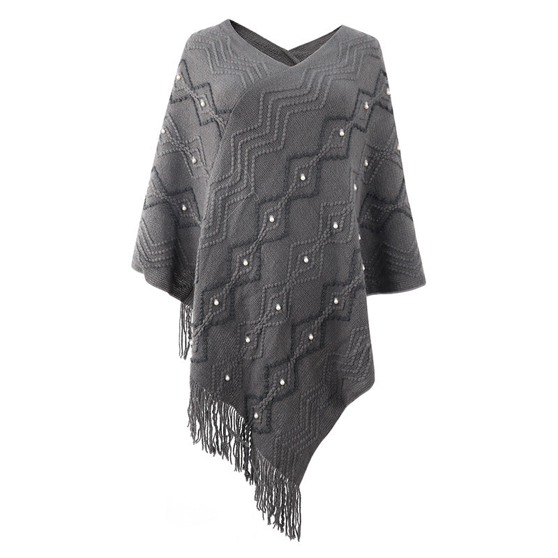 Damen eleganter Poncho mit auffälligem Strukturmuster und dekorativen Fransen ModeGeist