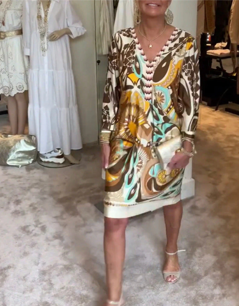 Elegantes Damen Freizeitkleid mit V-Ausschnitt und buntem Muster von MODEGEIST
