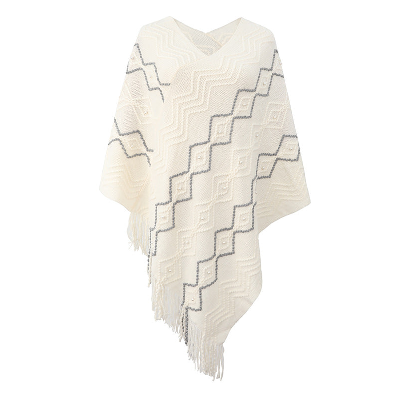 Damen eleganter Poncho mit auffälligem Strukturmuster und dekorativen Fransen ModeGeist