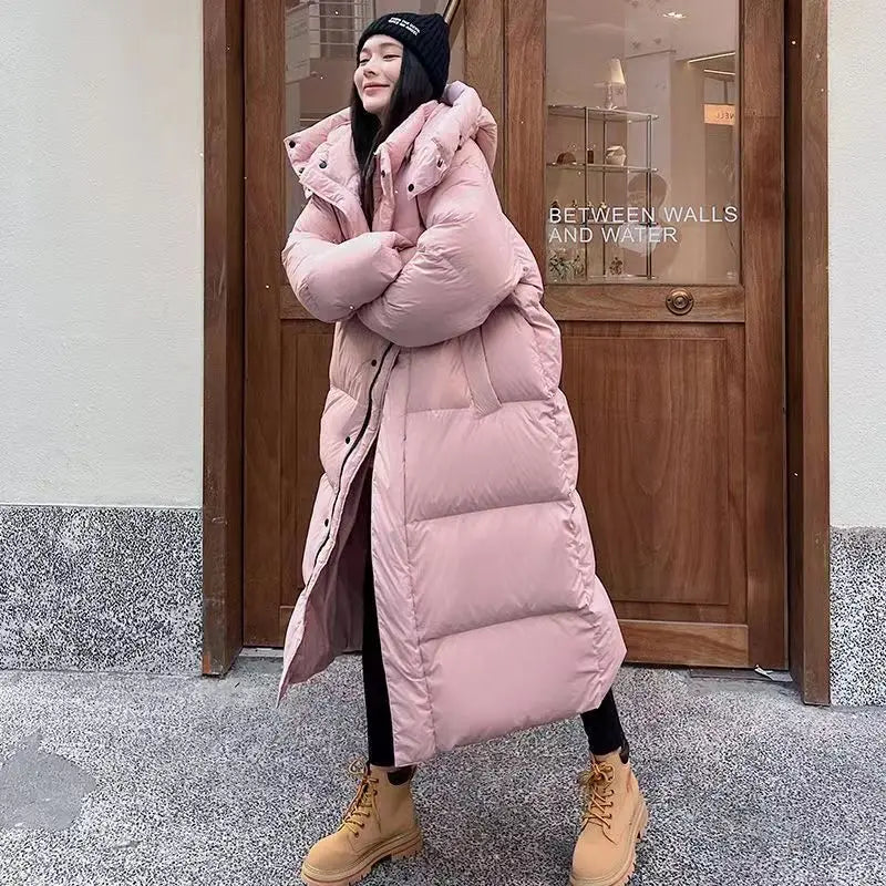 ModeGeist | Lange Pufferjacke mit Kapuze für Damen - Winter