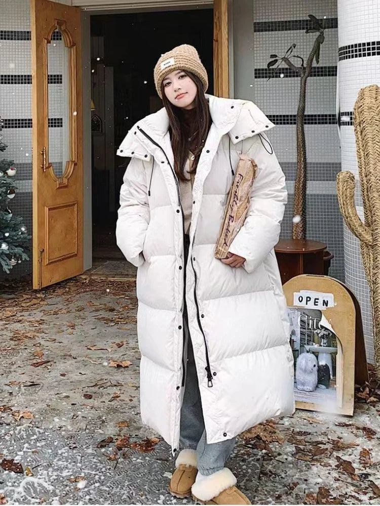 ModeGeist | Lange Pufferjacke mit Kapuze für Damen - Winter