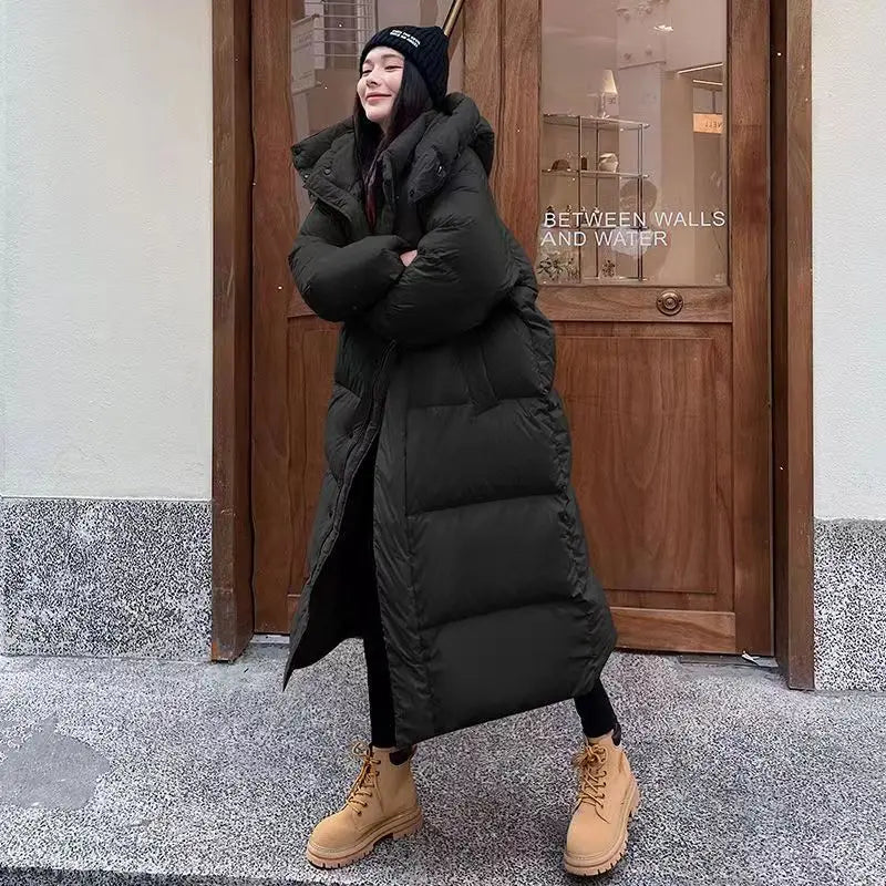 ModeGeist | Lange Pufferjacke mit Kapuze für Damen - Winter