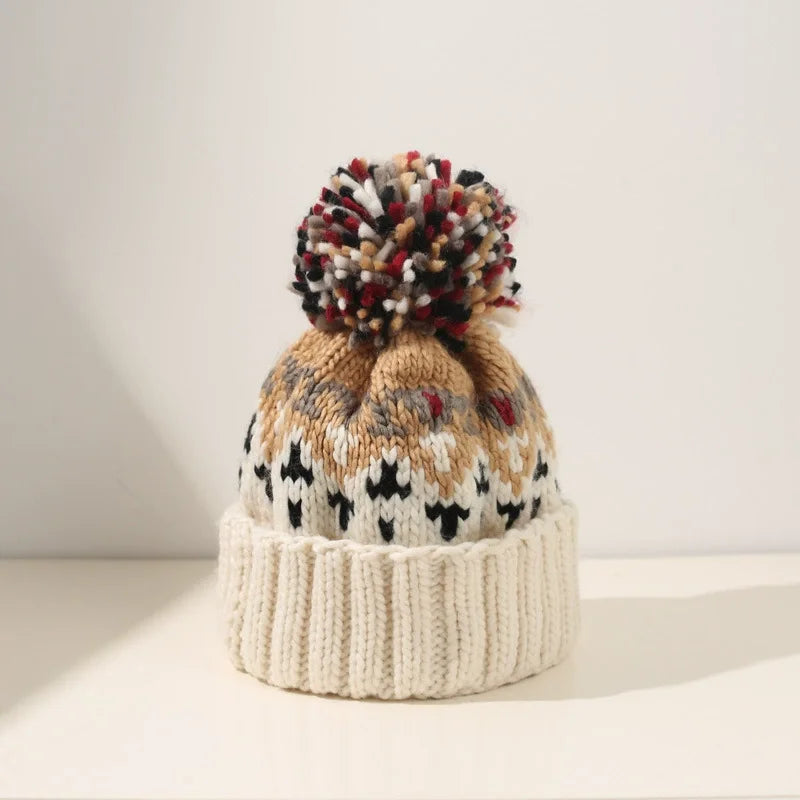 MODEGEIST Damen Winter-Mütze Schneeflocken-Muster Strick Bommel