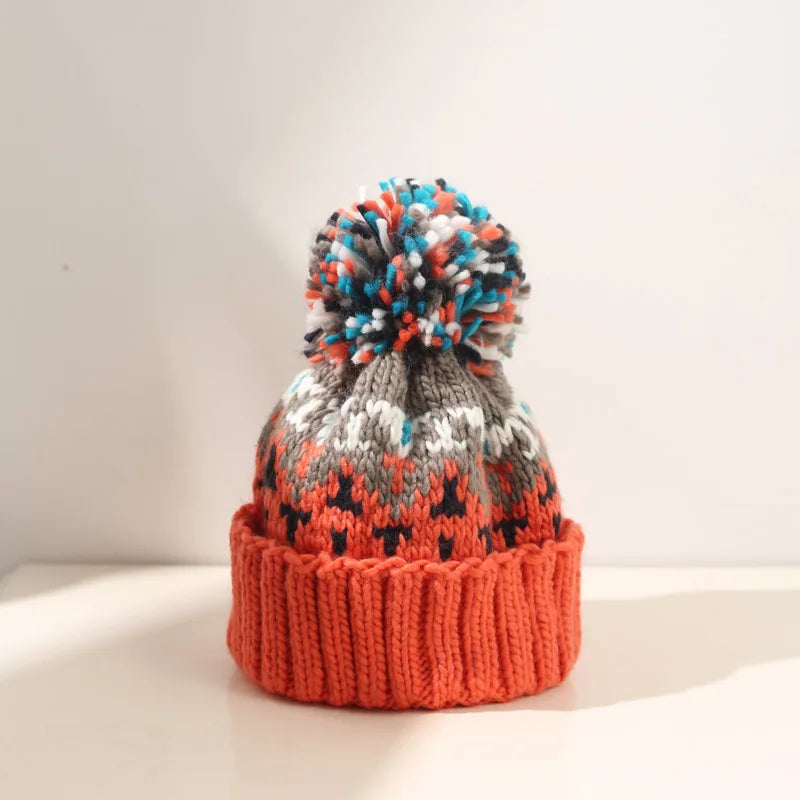 MODEGEIST Damen Winter-Mütze Schneeflocken-Muster Strick Bommel
